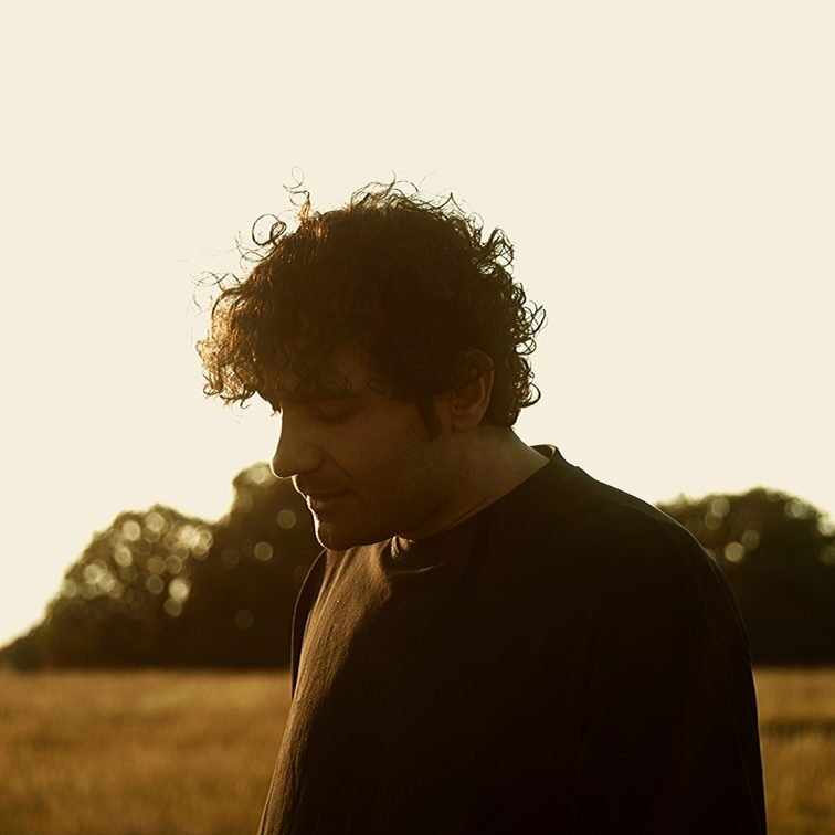 Mehran Rakhshandeh outdoor photoshoot - Persian singer in a natural setting.